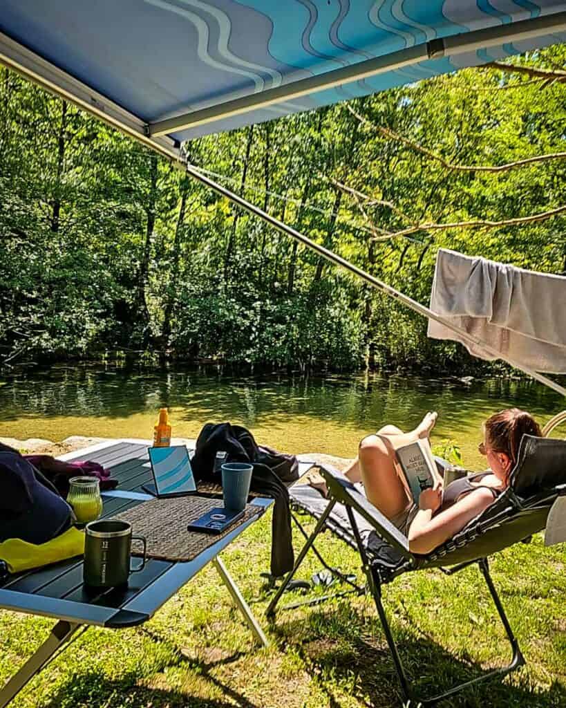 reading a book while camping in France (Veerle and Koen)