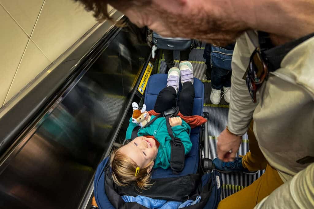 Stroller on escalator in Japan with kids